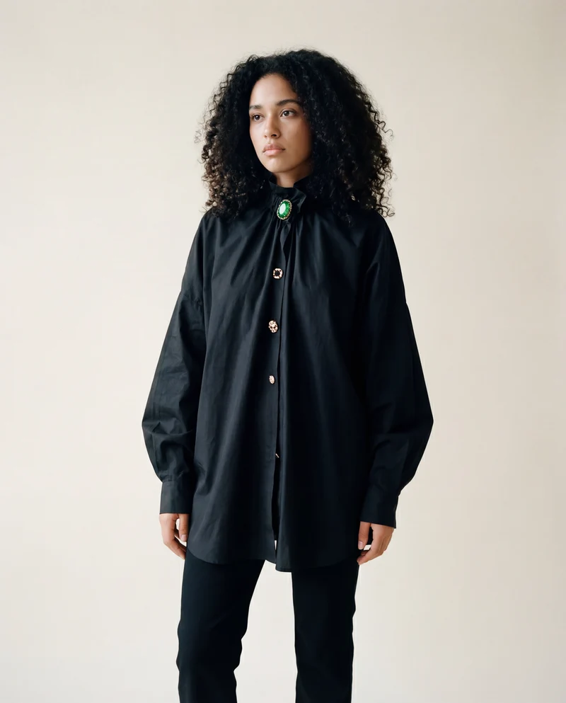 Ruffled Blouse with Decorative Buttons