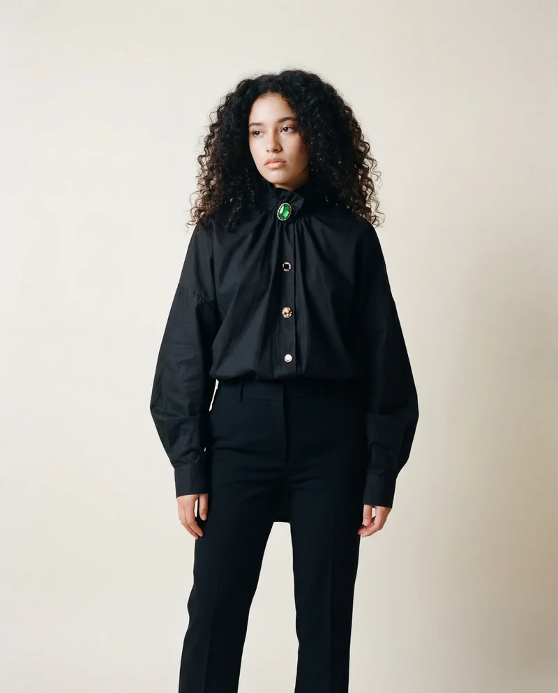 Ruffled Blouse with Decorative Buttons