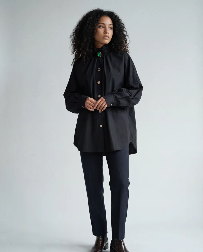 Ruffled Blouse with Decorative Buttons