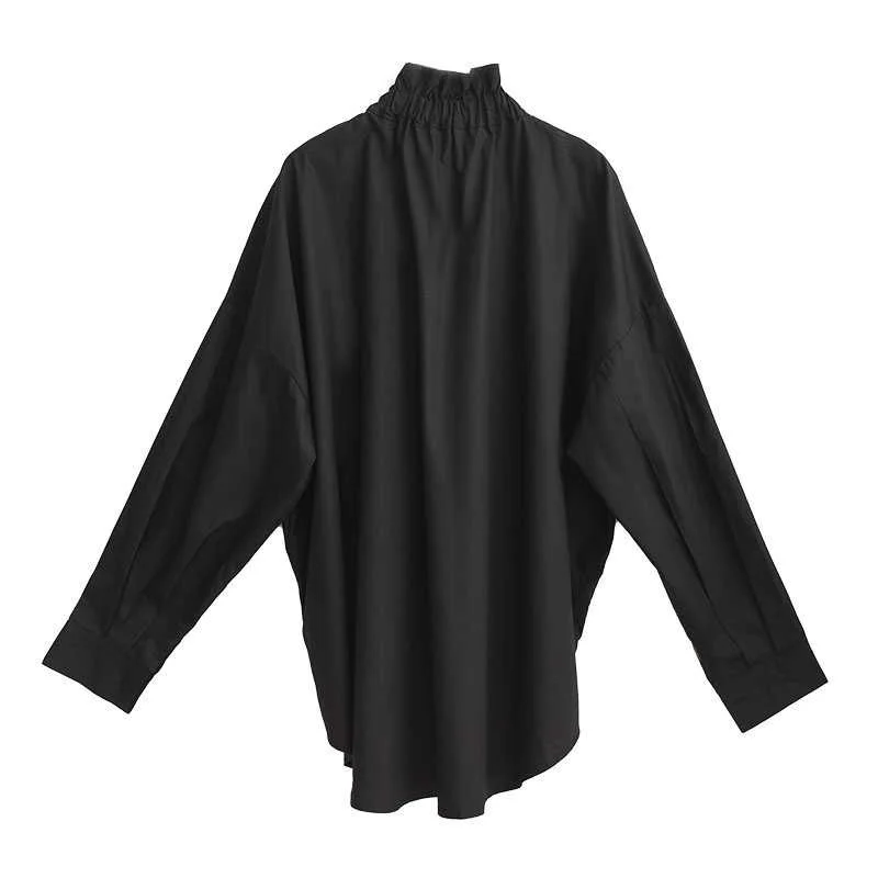 Ruffled Blouse with Decorative Buttons