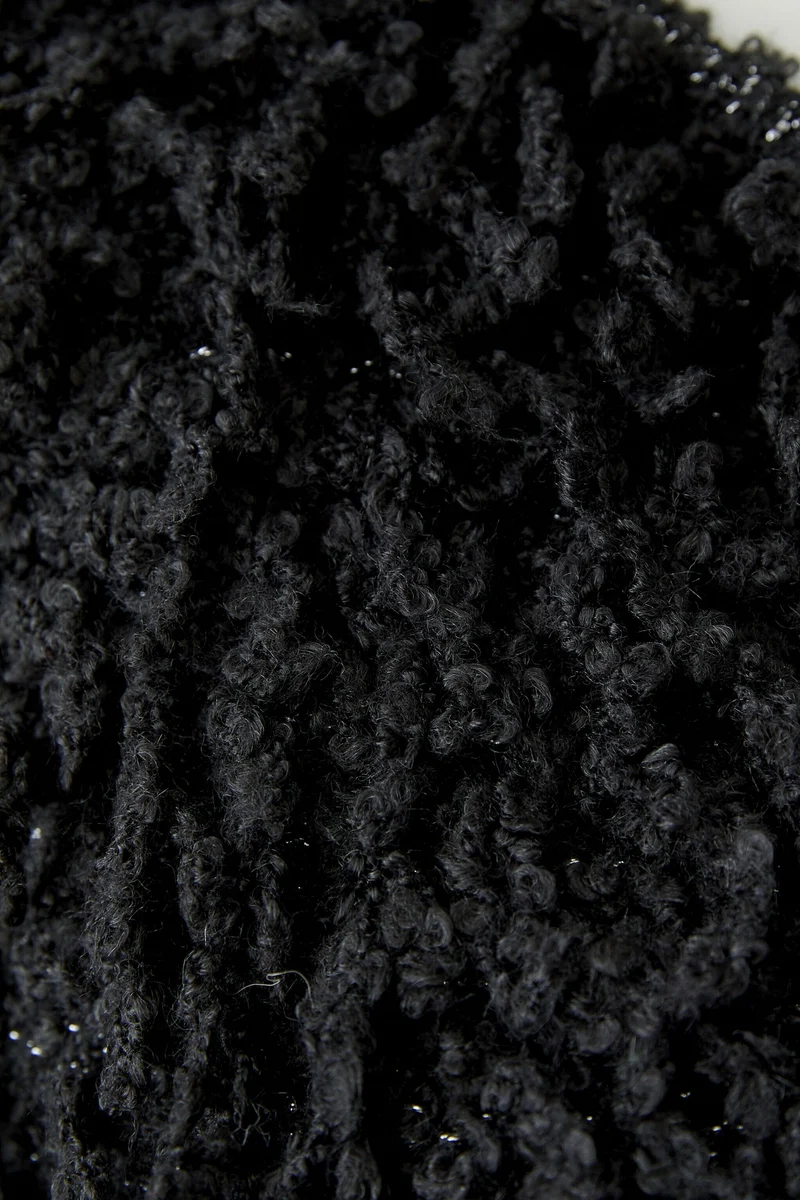 Veste courte à franges bouclées