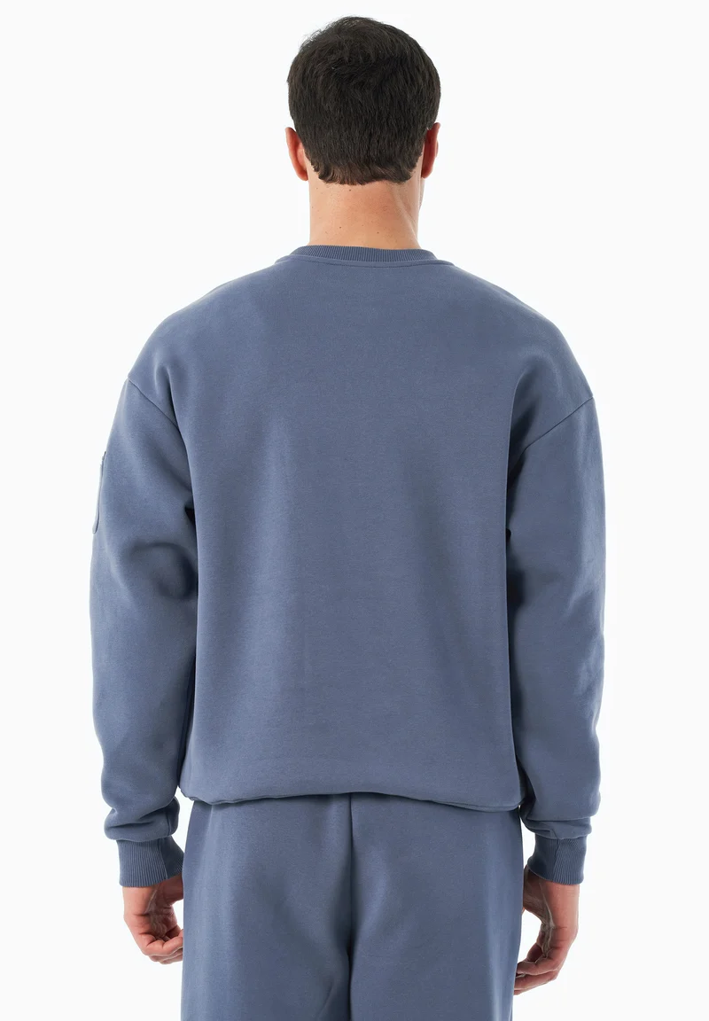SAYLORR | Essentials Travel Unisex Sweatshirt aus Bio-Baumwolle und recyceltem Polyester