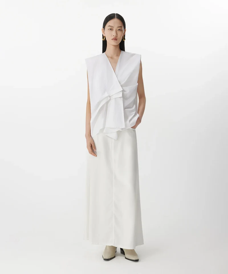 Blouse sans manches à plis asymétriques