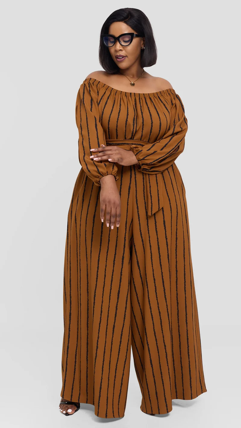 Vivo Yumi Off Shoulder Jumpsuit In Crepe - Rust / Black Print